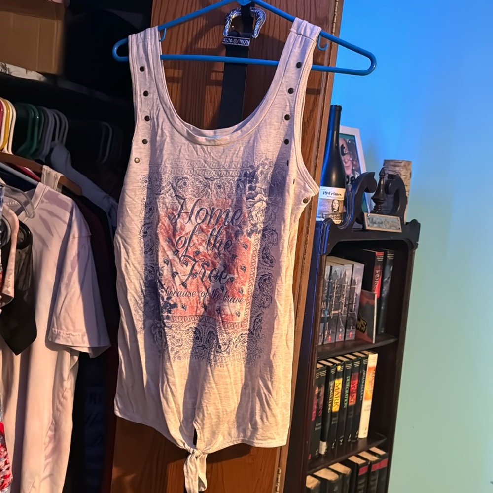 Maurice’s tank top “home of the free because of the brave “